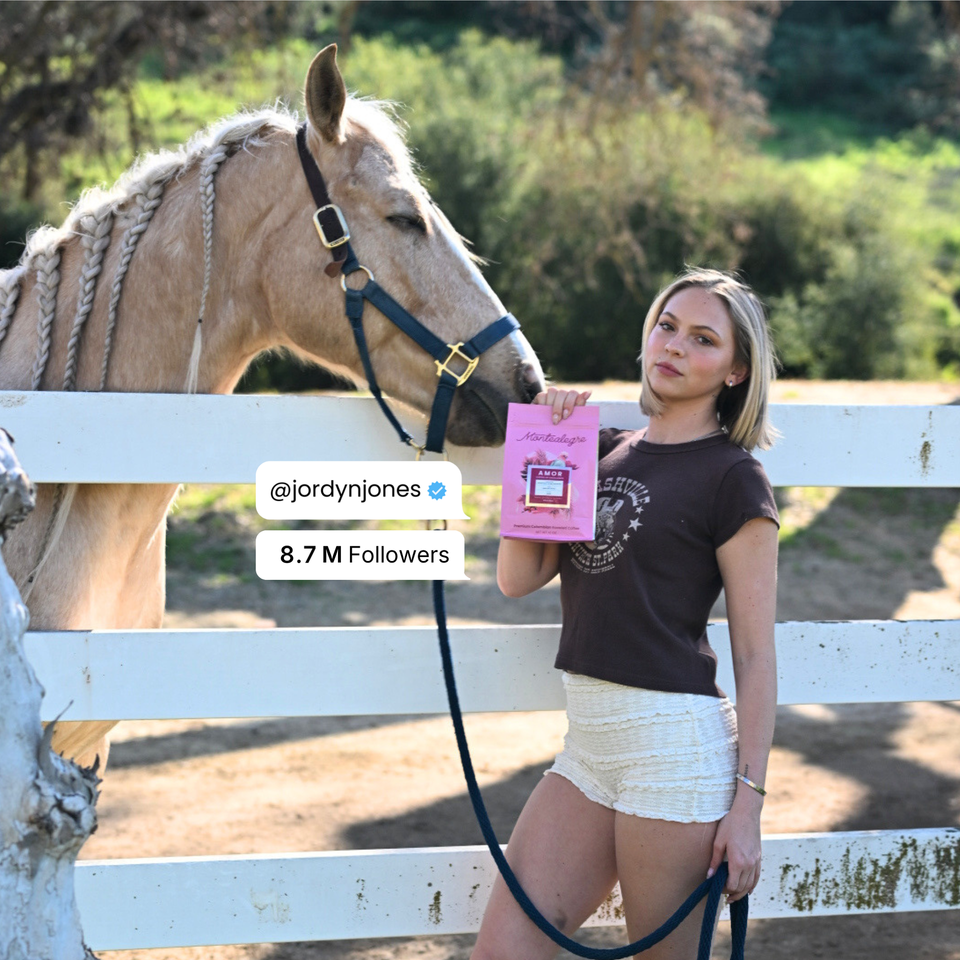 Jordyn Jones holding a bag of Amor coffee next to a horse